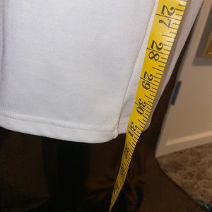 White calf length dress with a small slit in the back